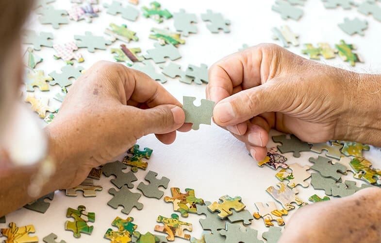 Senior-Couple-is-Playing-Puzzle.-613680534_5184x3456